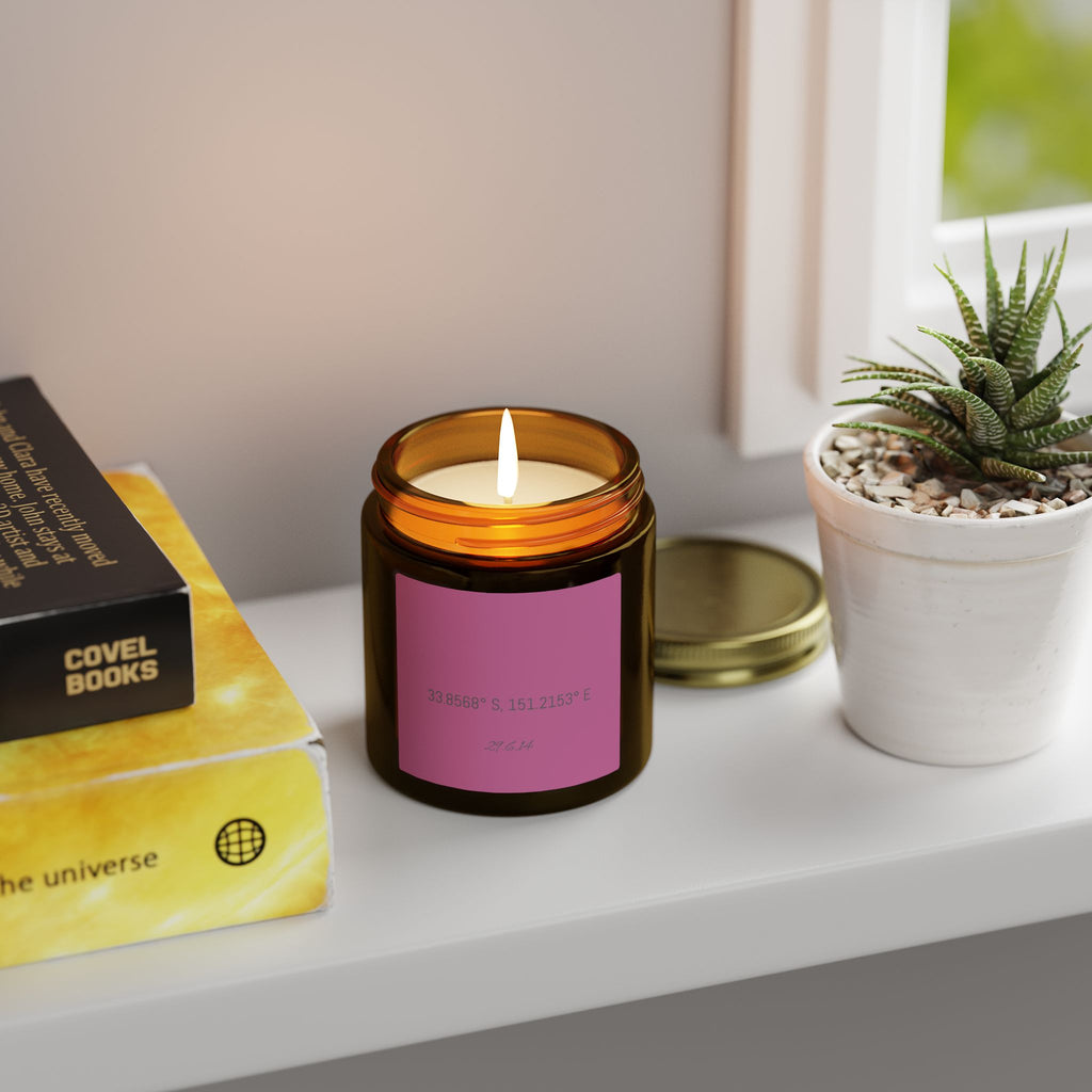 Amber jar candle with your coordinates on a windowsill